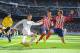 MADRID, SPAIN - FEBRUARY 27: Cristiano Ronaldo of Real Madrid crosses the ball while being challenged by Diego Godin and Felipe Luis of Club Atletico de Madridduring the La Liga match between Real Madrid CF and Club Atletico de Madrid at Estadio Santiag