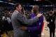 OAKLAND, CA - JANUARY 14: Kobe Bryant #24 of the Los Angeles Lakers hugs Golden State Warriors interim head coach Luke Walton after their game at ORACLE Arena on January 14, 2016 in Oakland, California. NOTE TO USER: User expressly acknowledges and agree
