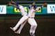 CHICAGO, IL - APRIL 26: Addison Russell #27 (L) and Ben Zobrist #18 of the Chicago Cubs celebrate a win over the Milwaukee Brewers at Wrigley Field on April 26, 2016 in Chicago, Illinois. The Cubs defeated the Brewers 4-3. (Photo by Jonathan Daniel/Getty
