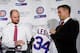 CHICAGO, IL - DECEMBER 15: Pitcher Jon Lester (L) is presented with a Cubs jersey by Chicago Cubs President Theo Epstein during an introduction press conference on December 15, 2014 in Chicago, Illinois. (Photo by David Banks/Getty Images)