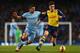 MANCHESTER, ENGLAND - JANUARY 18: Sergio Aguero of Manchester City challenges Hector Bellerin of Arsenal during the Barclays Premier League match between Manchester City and Arsenal at the Etihad Stadium on January 18, 2015 in Manchester, England. (Phot