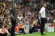 Real Madrid's Portuguese coach Jose Mourinho (L) and Barcelona's coach Josep Guardiola (R) look on during the second leg of the Spanish Supercup football match FC Barcelona vs Real Madrid CF on August 17, 2011 at the Camp Nou stadium in Barcelona. AFP
