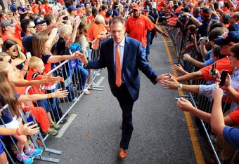 AUBURN, AL - SEPTEMBER 26: Head coach Gus Malzahn of the Auburn Tigers greets fans during the Tiger Walk prior to the game against the Mississippi State Bulldogs at Jordan Hare Stadium on September 26, 2015 in Auburn, Alabama. (Photo by Daniel Shirey/Ge
