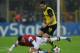 Dortmund's Armenian midfielder Henrikh Mkhitaryan and Arsenal's German midfielder Mesut Ozil (L) vie for the ball during the UEFA Champions League group F football match Borussia Dortmund vs Arsenal London in Dortmund, western Germany on November 6, 2013.