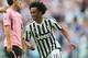 Juventus' midfielder Juan Cuadrado from Colombia celebrates after scoring with Juventus' defender Patrice Evra from France during the Italian Serie A football match Juventus vs Palermo on April 17, 2016 at the Juventus stadium in Turin. / AFP / MARCO BER