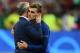 France's coach Didier Deschamps (L) consoles France's forward Antoine Griezmann after France lost 1-0 in the Euro 2016 final football match between France and Portugal at the Stade de France in Saint-Denis, north of Paris, on July 10, 2016. / AFP / FRANCK