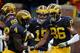 ANN ARBOR, MI - NOVEMBER 28: Jehu Chesson #86 of the Michigan Wolverines celebrates with teammates De'Veon Smith #4 and Jake Rudock #15 after catching a second quarter touchdown against the Ohio State Buckeyes at Michigan Stadium on November 28, 2015 in A
