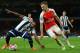 Arsenal's Welsh midfielder Aaron Ramsey (R) takes on West Bromwich Albion's Beninese midfielder Stephane Sessegnon (L) during the English Premier League football match between Arsenal and West Bromwich Albion at the Emirates Stadium in London on April 21,