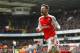Arsenal's Welsh midfielder Aaron Ramsey celebrates scoring his team's first goal during the English Premier League football match between Tottenham Hotspur and Arsenal at White Hart Lane in London, on March 5, 2016. / AFP / IKIMAGES / IKimages / RESTRICTE