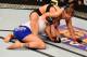 Rousey (top) grapples with Cat Zingano.