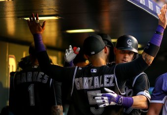 DENVER, CO - JULY 7:  Trevor Story #27 of the Colorado Rockies celebrates his solo home run with Carlos Gonzalez #5 during the fifth inning against the Philadelphia Phillies at Coors Field on July 7, 2016 in Denver, Colorado. (Photo by Justin Edmonds/Gett