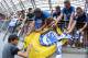 VELDEN, AUSTRIA - JULY 20: Head coach Antonio Conte (L) of Chelsea gives an autograph to fans prior the international friendly match between WAC RZ Pellets and Chelsea F.C. at Worthersee Stadion on July 20, 2016 in Velden, Austria. (Photo by Srdjan Steva