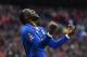 Everton's Belgian striker Romelu Lukaku celebrates after Manchester United's English defender Chris Smalling turned in a cross from Everton's Spanish midfielder Gerard Deulofeu to score an own goal to equalise the scores 1-1 during the English FA Cup semi