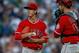 SEATTLE, WA - AUGUST 05: Starting pitcher Tim Lincecum #55 of the Los Angeles Angels of Anaheim gets a visit from catcher Jett Bandy #13 after giving up a two-run homer to Mike Zunino of the Seattle Mariners in the first inning at Safeco Field on August