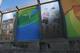 RIO DE JANEIRO, BRAZIL - JULY 18: A 'sound barrier' with posters advertising the Olympics is attached along a stretch of the main highway which links Rio's international airport to the city center and tourist areas running above the Mare favela community