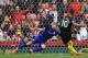 Manchester City's Argentinian striker Sergio Aguero scores the opening goal from the penalty spot past Stoke City's Irish goalkeeper Shay Given (L) during the English Premier League football match between Stoke City and Manchester City at the Bet365 Stadi