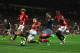 Blind and Bailly in defensive action at Old Trafford.