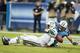 NASHVILLE, TN - SEPTEMBER 29: Geno Smith #7 of the New York Jets tries to get away from Karl Klug #97 of the Tennessee Titans and fumbles the football at LP Field on September 29, 2013 in Nashville, Tennessee. The Titans defeated the Jets 38-13. (Photo