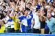 LONDON, ENGLAND - AUGUST 23: Bristol Rovers fans celebrate the goal scored by Peter Hartley during the EFL Cup second round match between Chelsea and Bristol Rovers at Stamford Bridge on August 23, 2016 in London, England. (Photo by Michael Regan/Getty