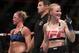 July 23, 2016; Chicago, IL, USA; Valentina Shevchenko (blue gloves) celebrates after defeating Holly Holm in their women's bantamweight bout during UFC Fight Night at United Center. Mandatory Credit: Kamil Krzaczynski-USA TODAY Sports