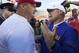 Wisconsin head coach Paul Chryst (left) and LSU head coach Les Miles