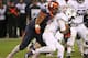 CHICAGO, IL - NOVEMBER 28: Dawuane Smoot #91 of the Illinois Fighting Illini moves to tackle Justin Jackson #21 of the Northwestern Wildcats at Soldier Field on November 28, 2015 in Chicago, Illinois. Northwestern defeated Illinois 24-14. (Photo by Jonath