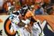Brandon Marshall slams into Cam Newton.
