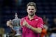 NEW YORK, NY - SEPTEMBER 11: Stan Wawrinka of Switzerland celebrates with the trophy after defeating Novak Djokovic of Serbia with a score of 6-7, 6-4, 7-5, 6-3 during their Men's Singles Final Match on Day Fourteen of the 2016 US Open at the USTA Billie
