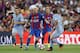 Torreira faces down Lionel Messi in a pre-season friendly.