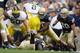 SOUTH BEND,IN - SEPTEMBER 13: Neal Kerry #56 of the Notre Dame Fighting Irish tackles Sam McGuffie #2 during the game against the Michigan Wolverines on September 13, 2008 at Notre Dame Stadium in South Bend, Indiana. (Photo by: Gregory Shamus/Getty Imag