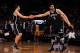 DENVER, CO - MARCH 4: Brook Lopez #11 of the Brooklyn Nets high fives his teammate Bojan Bogdanovic #44 of the Brooklyn Nets during the game against the Denver Nuggets on March 4, 2016 at the Pepsi Center in Denver, Colorado. NOTE TO USER: User expressly