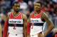 WASHINGTON, DC - APRIL 26: John Wall #2 and Bradley Beal #3 of the Washington Wizards talk during the game against the Toronto Raptors during Game Four of the Eastern Conference Quarterfinals of the NBA playoffs at Verizon Center on April 26, 2015 in Was
