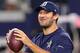 ARLINGTON, TX - SEPTEMBER 25: Injured Tony Romo #9 of the Dallas Cowboys throws prior to a game against the Chicago Bears at AT&T Stadium on September 25, 2016 in Arlington, Texas. (Photo by Tom Pennington/Getty Images)