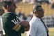 Green Bay Packers Hall of Fame head coach Vince Lombardi adn backup quarterback Zeke Bratkowski (12) watch the team warm up before Super Bowl I, a 35-10 victory over the Kansas City Chiefs on January 15, 1967, at the Los Angeles Memorial Coliseum in Los A
