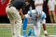 ATLANTA, GA - OCTOBER 02: Cam Newton #1 of the Carolina Panthers is worked on by a trainer during a timeout after taking a hit on a rush against the Atlanta Falcons at Georgia Dome on October 2, 2016 in Atlanta, Georgia. (Photo by Kevin C. Cox/Getty Ima
