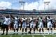 JACKSONVILLE, FL - SEPTEMBER 25: Jacksonville Jaguars players raise their arms in protest during the National Anthem prior to the game against the Baltimore Ravens at EverBank Field on September 25, 2016 in Jacksonville, Florida. (Photo by Maddie Meyer/