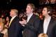 Donald Trump and sons taking in an Affliction event.
