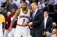 CLEVELAND, OH - APRIL 17: Kyrie Irving #2 of the Cleveland Cavaliers talks to head coach Tyronn Lue during the second half of the NBA Eastern Conference quarterfinals against the Detroit Pistons at Quicken Loans Arena on April 17, 2016 in Cleveland, Ohio.