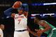 NEW YORK, NY - OCTOBER 15: Carmelo Anthony #7 of the New York Knicks defended by Jaylen Brown #7 of the Boston Celtics during the first half of their preseason game at Madison Square Garden on October 15, 2016 in New York City. NOTE TO USER: User express