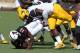 Oct 15, 2016; Lubbock, TX, USA; Texas Tech Red Raiders running back Cameron Batson (13) is driven to the ground by West Virginia Mountaineers defensive lineman David Long (11) at Jones AT&T Stadium. West Virginia defeated Texas Tech 48-17. Mandatory Cred