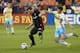 Sep 28, 2016; Washington, DC, USA; D.C. United forward Patrick Mullins (16) and Columbus Crew midfielder Will Trapp (20) battle for the ball in the first half at Robert F. Kennedy Memorial Stadium. Mandatory Credit: Geoff Burke-USA TODAY Sports