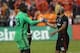Sep 28, 2016; Washington, DC, USA; D.C. United goalkeeper Bill Hamid (28) celebrates with D.C. United midfielder Nick DeLeon (14) after their game against Columbus Crew SC at Robert F. Kennedy Memorial Stadium. United won 3-0. Mandatory Credit: Geoff Burk