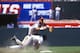 Carlos Baerga getting taken out on a play at second base.