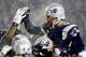 FOXBORO, MA - JANUARY 19: Field kicker Adam Vinatieri (L) of the New England Patriots celebrates after making a field goal in overtime against the Oakland Raiders in their AFC playoff game for a 16-13 win 19 January 2002 at Foxboro Stadium in Foxboro, Ma