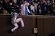CHICAGO, IL - OCTOBER 30: Jason Heyward #22 of the Chicago Cubs climbs the wall to catch a foul ball in the third inning against the Cleveland Indians in Game Five of the 2016 World Series at Wrigley Field on October 30, 2016 in Chicago, Illinois. (Phot