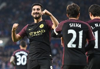 Manchester City's German midfielder Ilkay Gundogan (L) celebrates after scoring their third goal during the English Premier League football match between West Bromwich Albion and Manchester City at The Hawthorns stadium in West Bromwich, central England, 