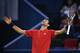 Novak Djokovic of Serbia reacts after to a point against Mischa Zverev of Germany during their men's singles match at the Shanghai Masters tennis tournament on October 14, 2016. / AFP / JOHANNES EISELE (Photo credit should read JOHANNES EISELE/AFP/