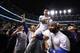 CLEVELAND, OH - NOVEMBER 02: Anthony Rizzo #44, David Ross #3 and Jason Heyward #22 of the Chicago Cubs celebrate with actor John Cusack (R) after defeating the Cleveland Indians 8-7 in Game Seven of the 2016 World Series at Progressive Field on November