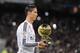 MADRID, SPAIN - JANUARY 15: Cristiano Ronaldo of Real Madrid salutes with his FIFA Ballon d'Or before the Copa del Rey Round of 16, Second leg match between Real Madrid and Atletico de Madrid at Estadio Santiago Bernabeu on January 15, 2015 in Madrid, Sp