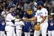 Oct 18, 2016; Los Angeles, CA, USA; Los Angeles Dodgers relief pitcher Kenley Jansen (74) celebrates with catcher Yasmani Grandal (9) after beating the Chicago Cubs in game three of the 2016 NLCS playoff baseball series at Dodger Stadium. Mandatory Credit